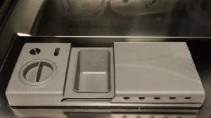 Rinse Aid dispenser filled with liquid for spotless dishes