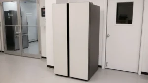 A large, vintage refrigerator-like computer mainframe