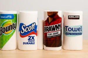 Best paper towels including Bounty, Scott, Brawny, and Kirkland lined up on a table for comparison.