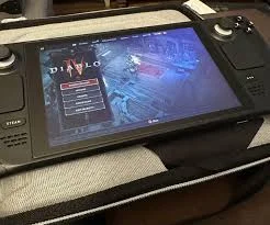 A Steam Deck displaying Diablo 4's character selection screen on its handheld display.