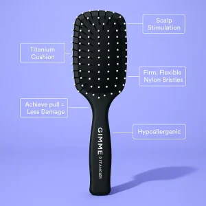 Black paddle hairbrush with labels