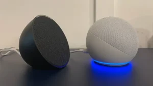 Echo pop vs echo dot smart speakers side by side on a table