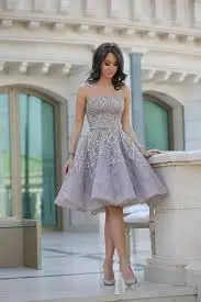 Elegant woman in stylish gray dress