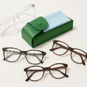 Three eyeglasses with green case and cloth