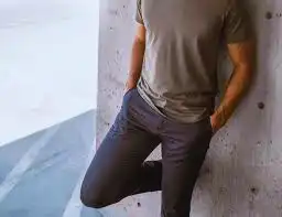 Man wearing Perk chinos and t-shirt casually