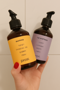 Hand holding two Prose bottles