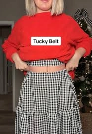 Close-up of a pink Tucky Belt wrapped around a waist