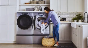 Woman using modern washers with agitators