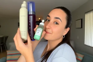 Woman holding top-rated skincare products for glowing skin.