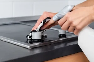 Close-up of stovetop cleaning