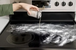 Using powder to clean stovetop